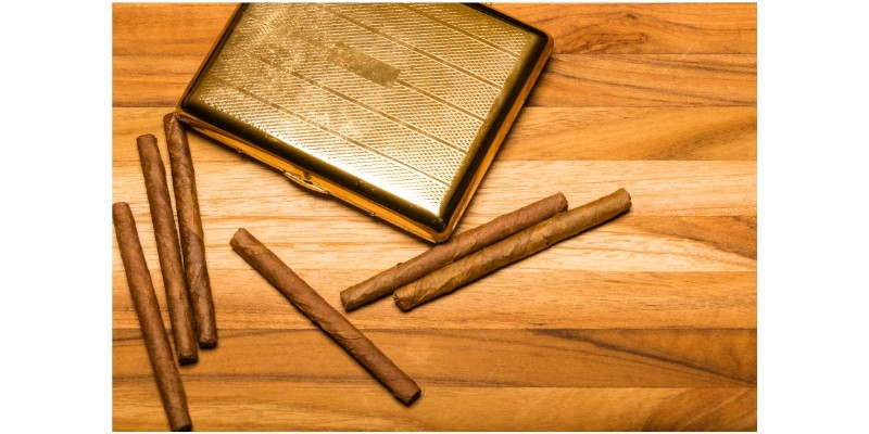 brass case and cuban cigarillos