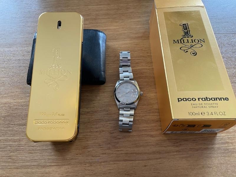 paco rabanne 1 million bottle with box and wallet and watch for scale