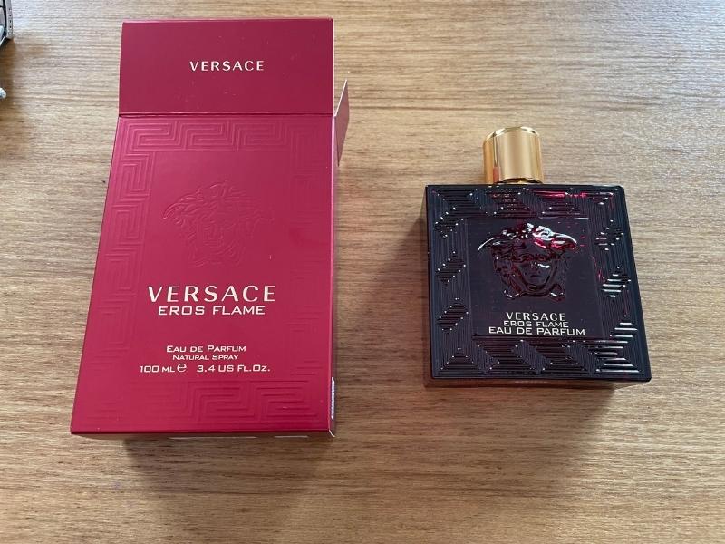versace eros flame alongside open box