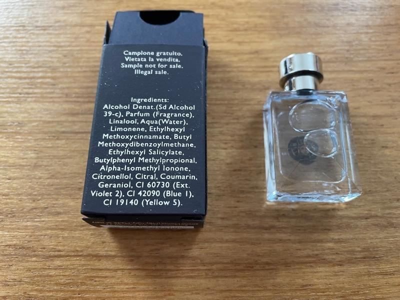 back of a versace pour homme bottle and box